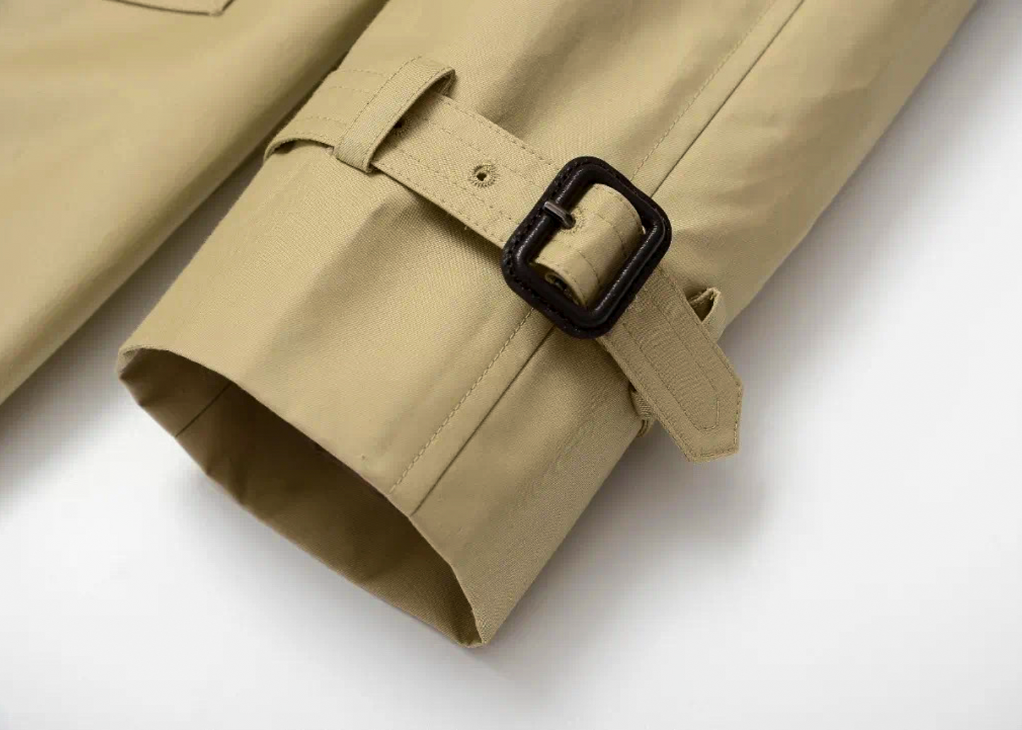 Close-up of Moonland Khaki trench coat with strapped cuff with a black buckle #color_khaki #color_cypress-green