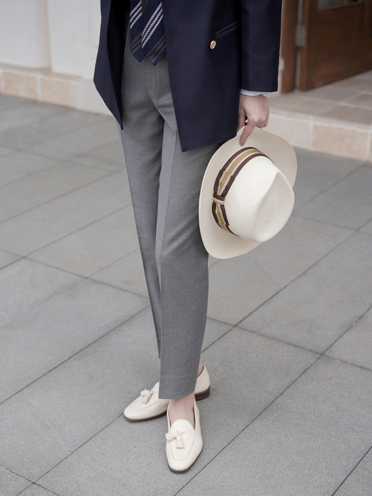 Moonland Ivy Trousers, straight leg with sharp front crease and clean hem, styled with navy blazer and cream loafers.