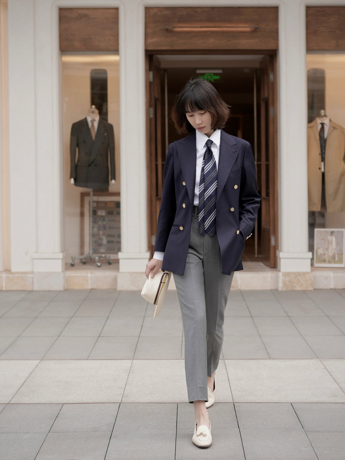 Moonland Ivy double breasted navy wool blazer, front view, wide and sharp peak lapels and gold buttons, business casual styling