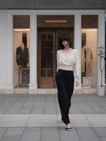 Moonland Monday worsted wool trousers in black, high-rise waist, straight cut with central pleat turning into a sharp crease.