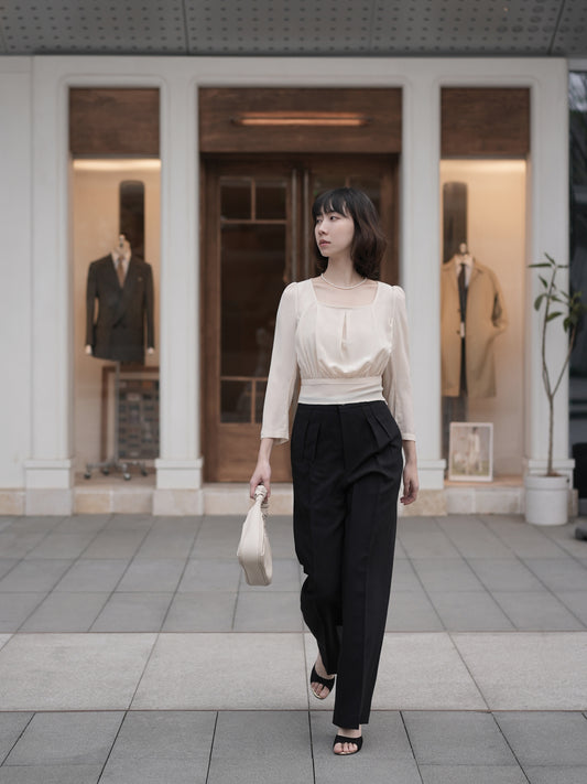 Moonland Monday worsted wool trousers in black, high-rise waist, straight cut with central pleat turning into a sharp crease.