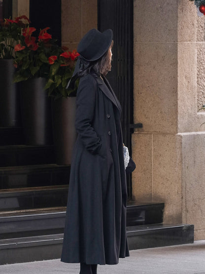 Moonland Modern Redingote Coat Side view showing princess seams and sculpted waist and side welt pockets, flowing full length classic double-faced black cashmere coat