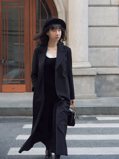 Moonland Modern Redingote coat front view, double breasted with peak lapels, full length fit and flare, double-faced black cashmere coat