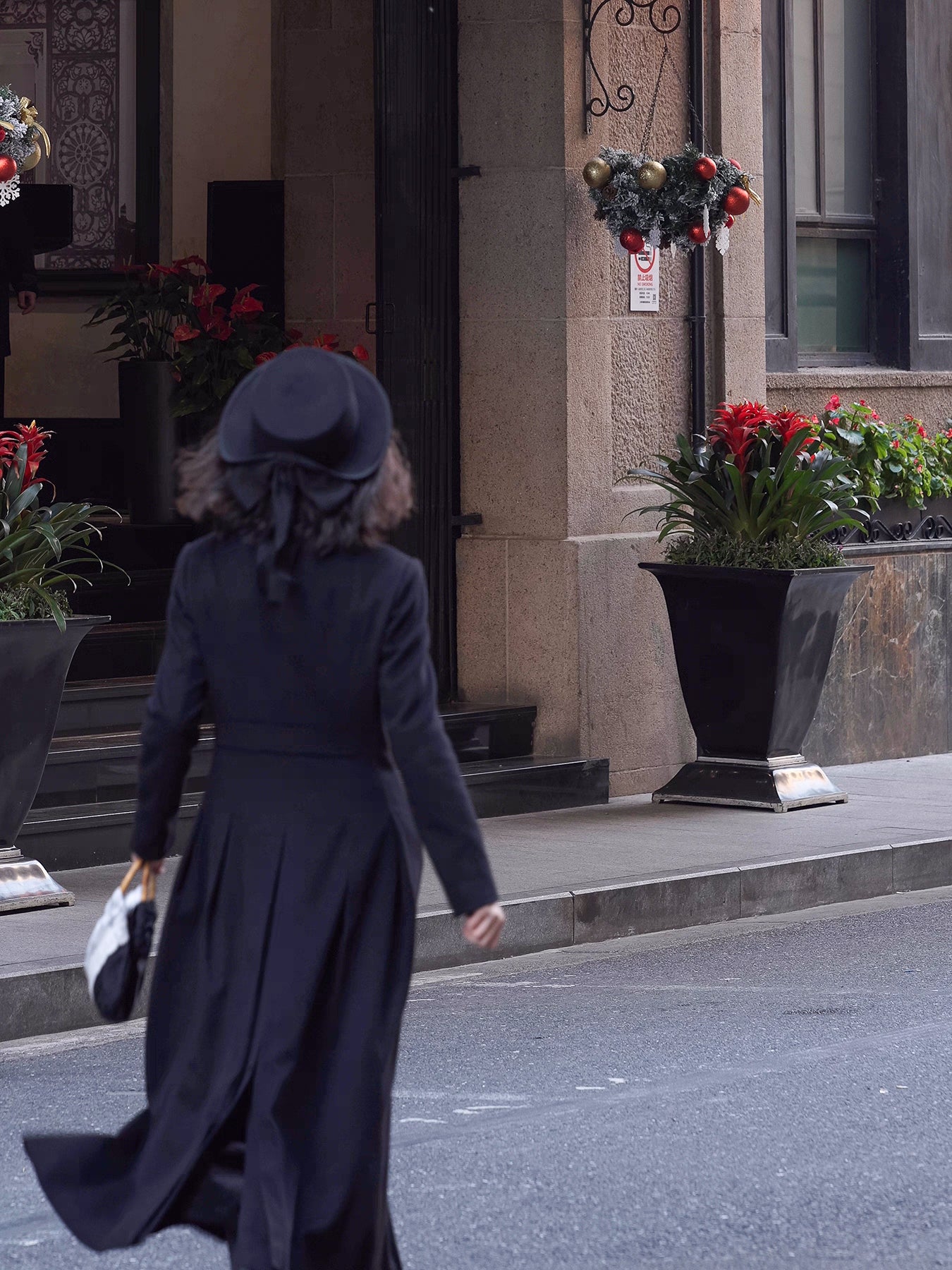 Moonland Modern Redingote coat back view, pleated skirt with defined waist and center vent, full length double-faced black cashmere coat