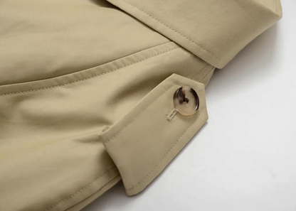 Close-up of Moonland khaki trench coat with a button on a epaulette #color_khaki #color_cypress-green