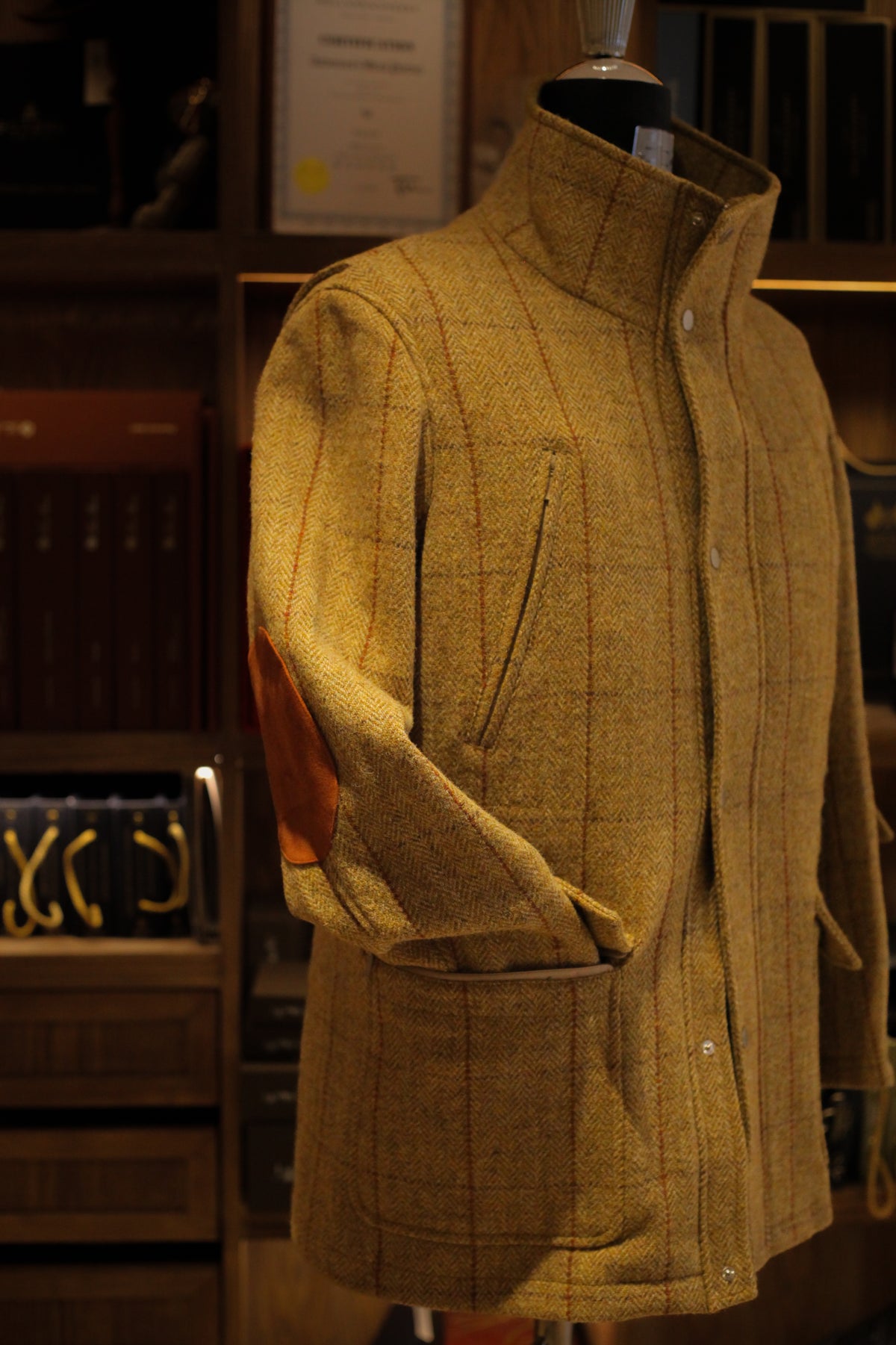 Urban Alpine Jacket in ochre Harris Tweed, front three-quarter view with suede elbow patch