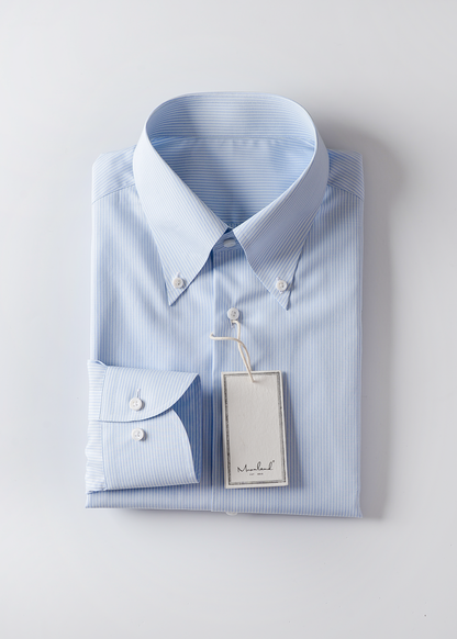 Folded light blue striped dress shirt with a tag on a light gray background #color_baby-blue