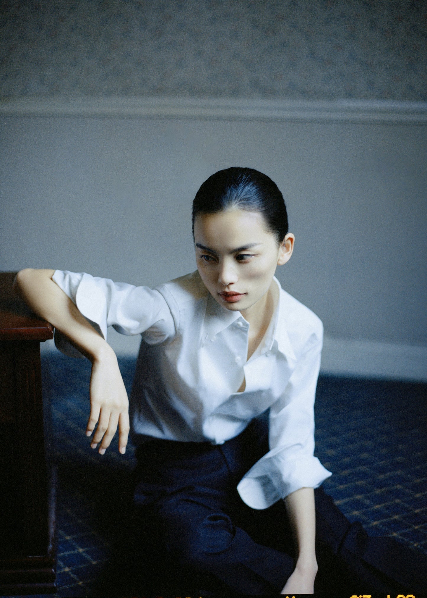 Moonland The Moonlight Shirt in white cotton, sleeves casually rolled, collar opened, styled with dark trousers